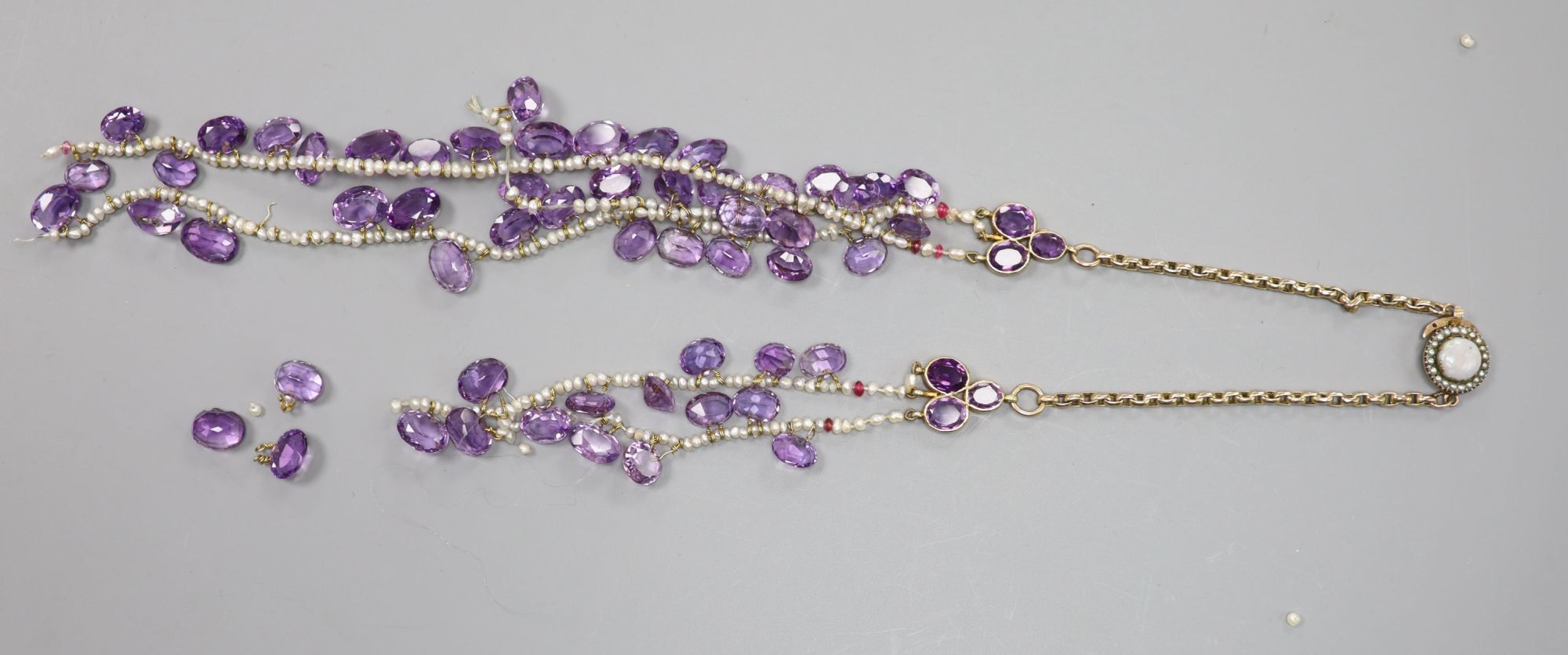 An amethyst, seed pearl and part yellow metal link necklace, with white opal set clasp(a.f.), gross weight 58 grams.